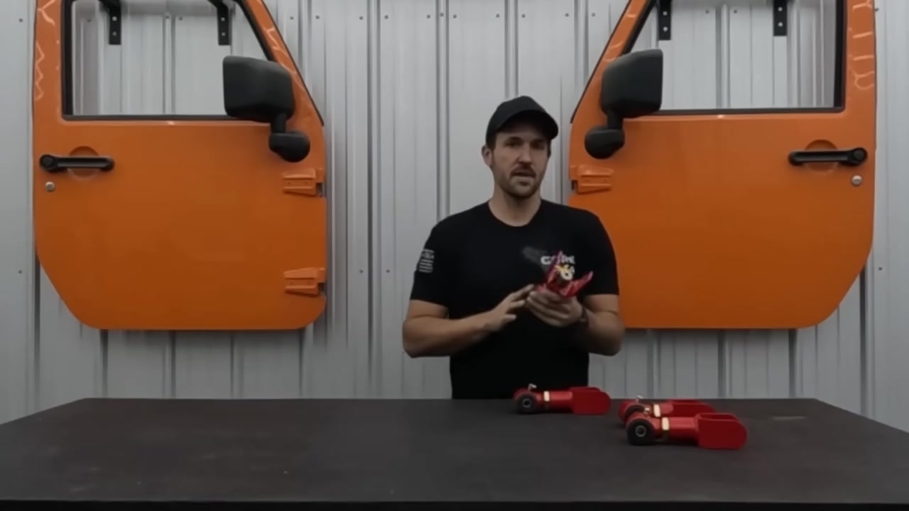 Core 4x4 adjustable leaf spring shackles laid out on workbench