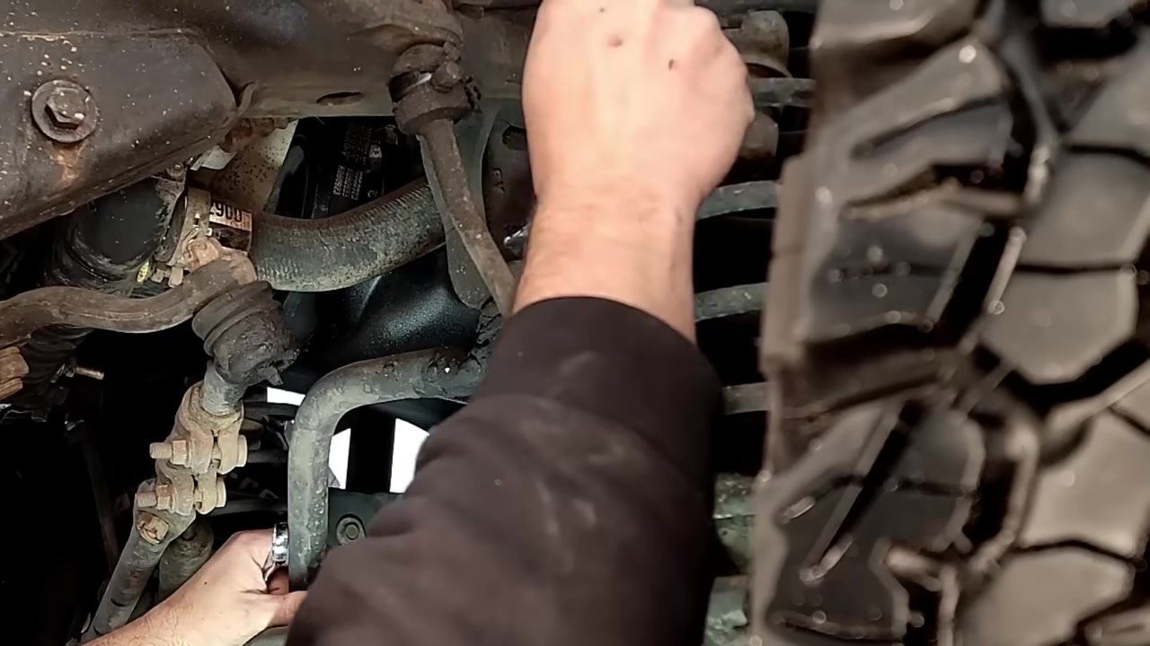 Drilling out the frame-side bracket to accept the new 5/8 inch bolt