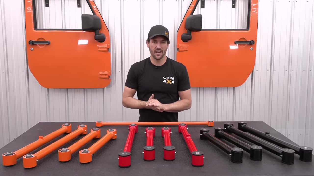 All three Core 4x4 control arm series laid out on a table - Town in dark, Trail in red, Track in orange