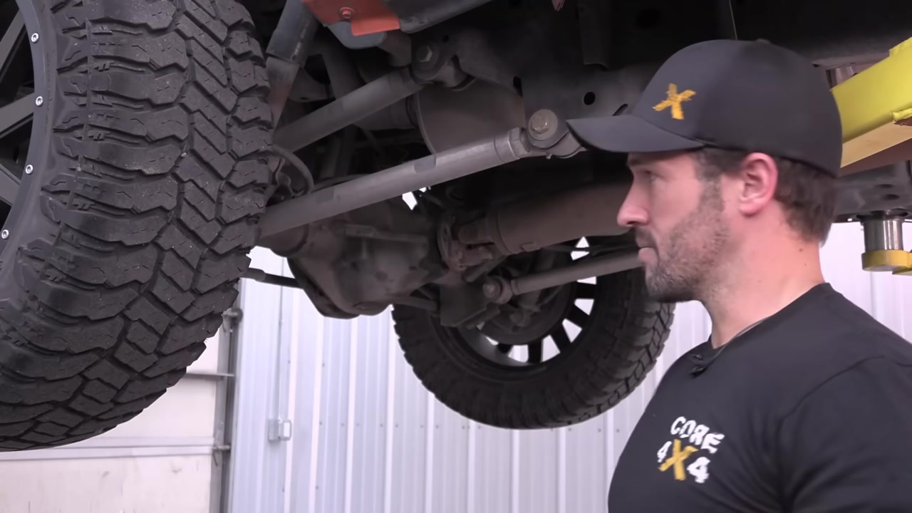 Underside of Ram 1500 showing rear suspension and factory control arm mounting points