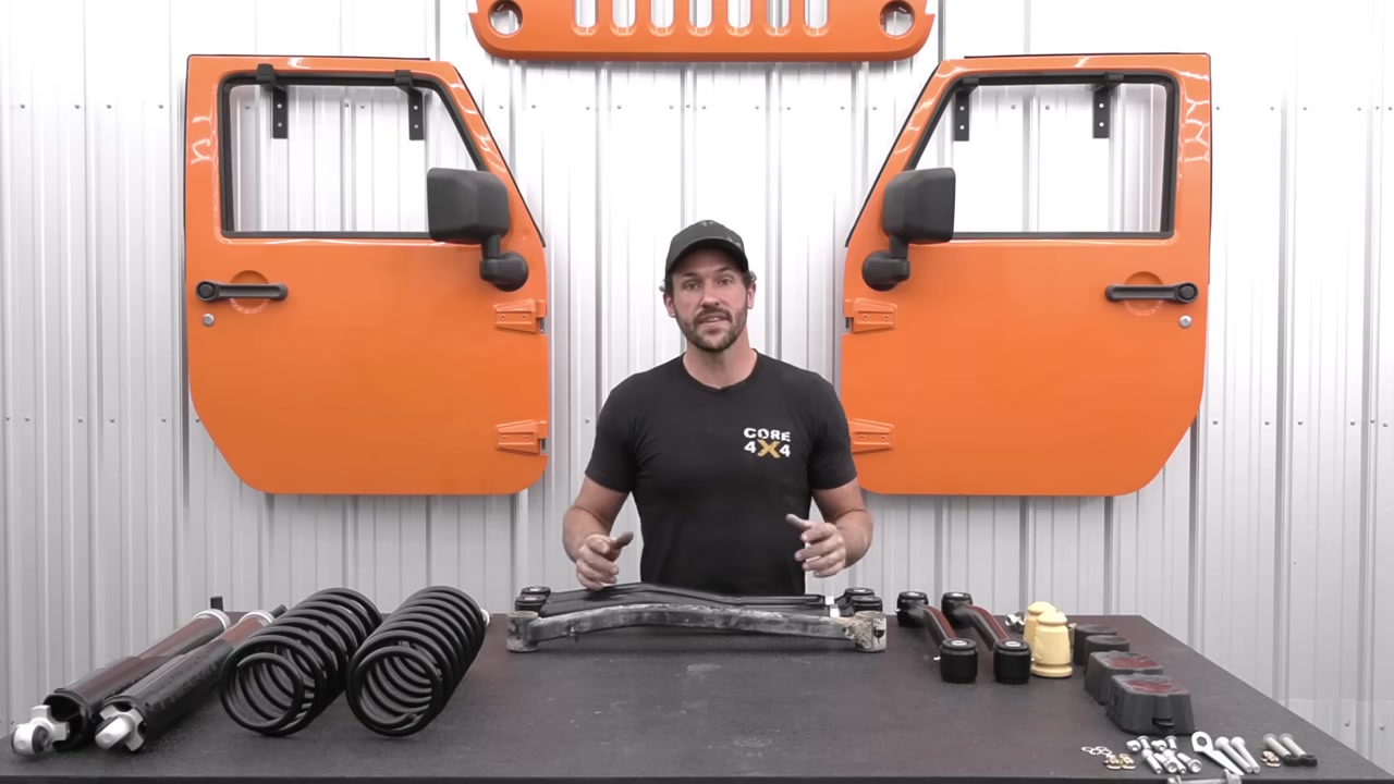 Spence at the Core 4x4 workbench explaining caster angle with JL control arms