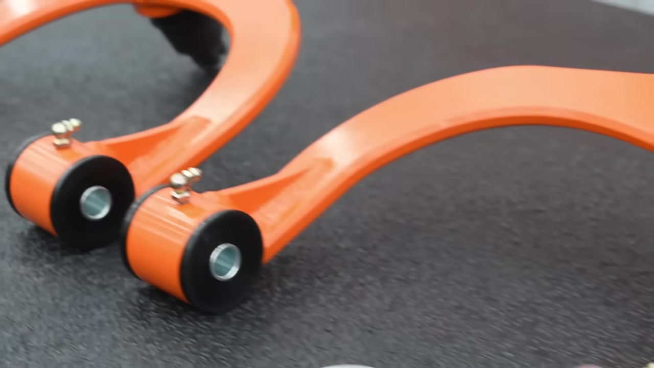 CORE 4X4 front upper control arms for Toyota Tacoma showing polyurethane bushings grease fittings and two-stage powder coat finish