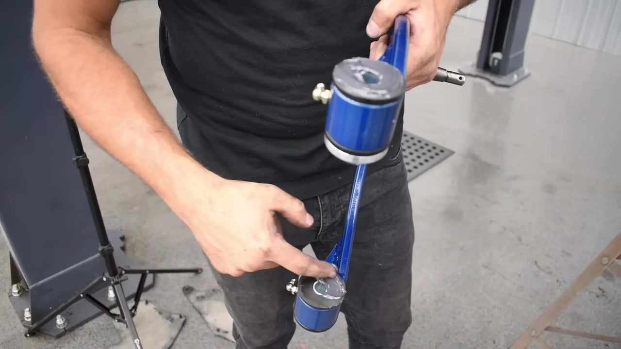 Close-up of CORE 4X4 upper control arm showing polyurethane bushings independent crush sleeves and 90-degree grease fittings