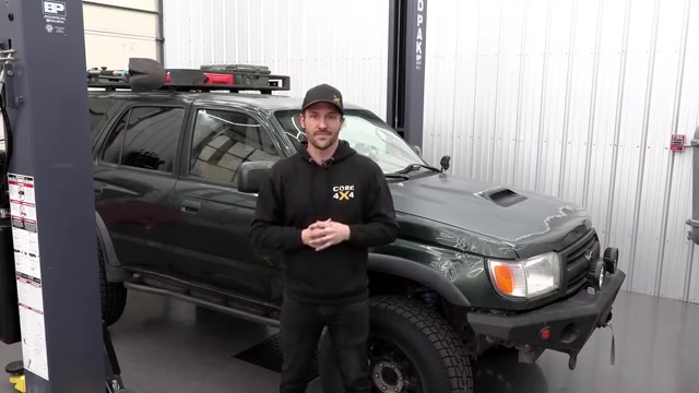 Spence from Core 4x4 in front of the green third-gen 4Runner introducing the Camp Series rear control arm kit