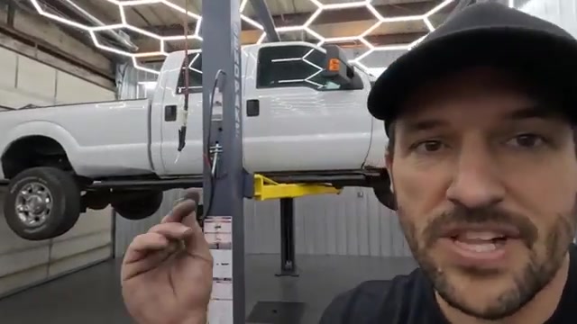 Ford F-350 Super Duty on lift in Core 4x4 shop ready for steering teardown