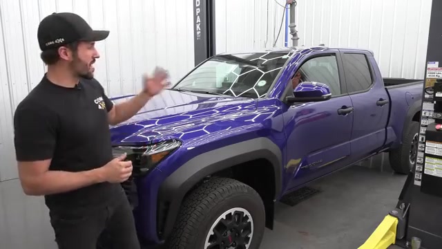 2024 Toyota Tacoma parked in the Core 4x4 shop before the rear suspension upgrade showing the truck from the front quarter