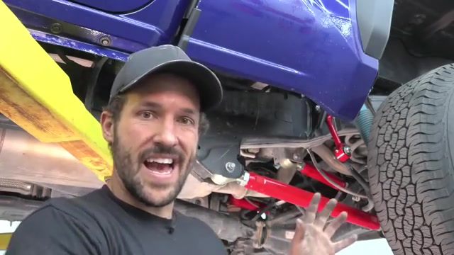 Completed rear suspension upgrade on the 2024 Toyota Tacoma showing new Core 4x4 control arms, end links, and track bar installed