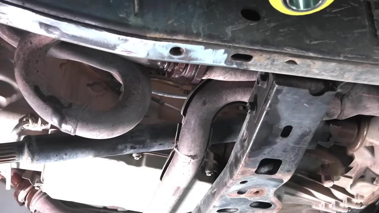 Underside of the JK Wrangler showing the exhaust and frame rails where the long arm brackets will be welded