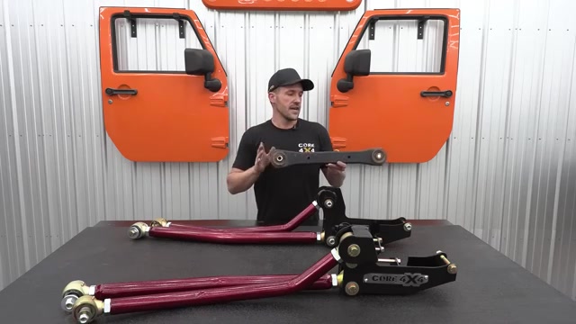 Spence at Core 4x4 with the long arm kit control arms and brackets on the workbench