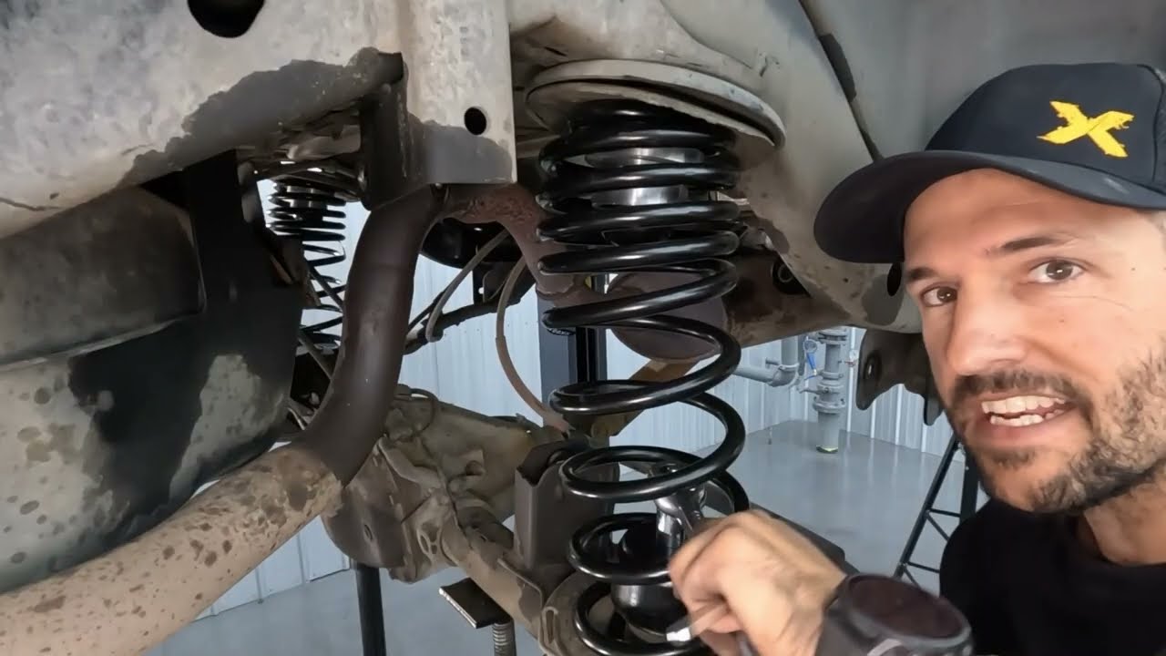 Trackbar relocation bracket installation on the LJ rear axle