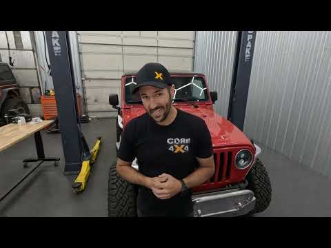 Sway bar end link installation on the rear of the LJ Wrangler during lift kit build
