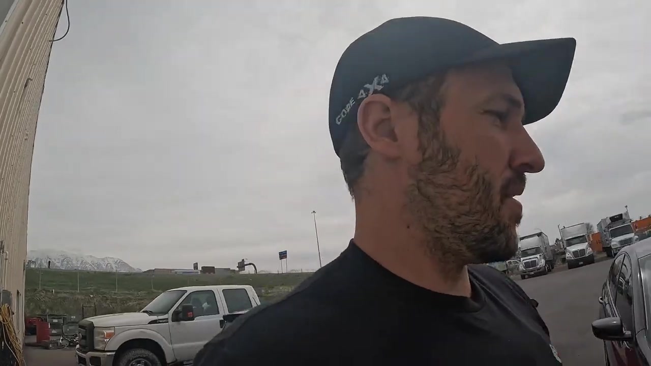 Spence outside the Core 4x4 building talking about the table move logistics with mountains visible in the background