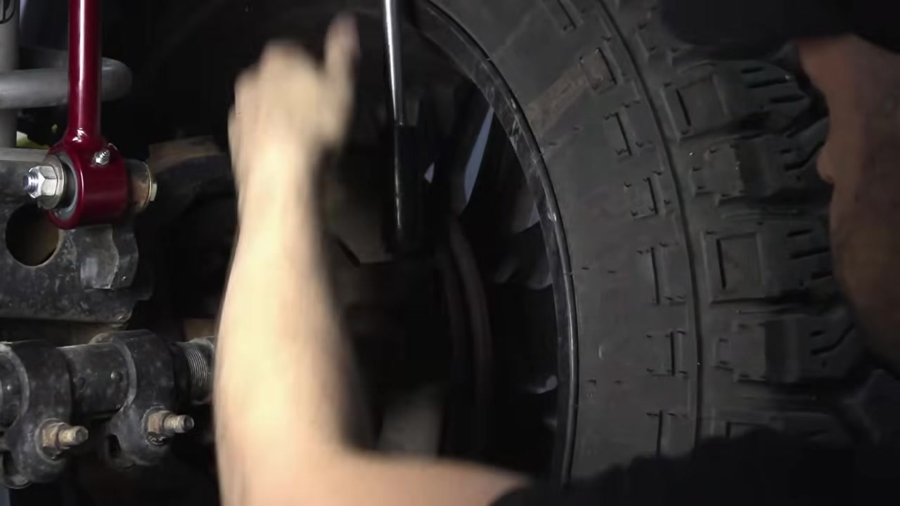Removing factory steering components from under the Ram 3500 with penetrating fluid applied