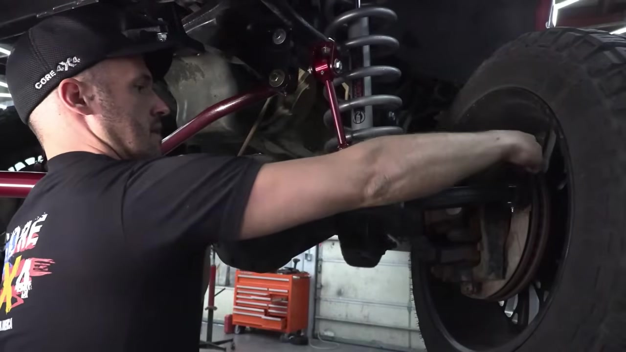 Installing the new Core 4x4 tie rod on the Ram 3500 front axle knuckles