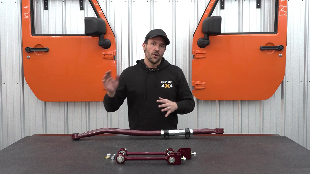 Core 4x4 adjustable track bar and Tow Series sway bar end links in Illusion Cherry powder coat on the workbench