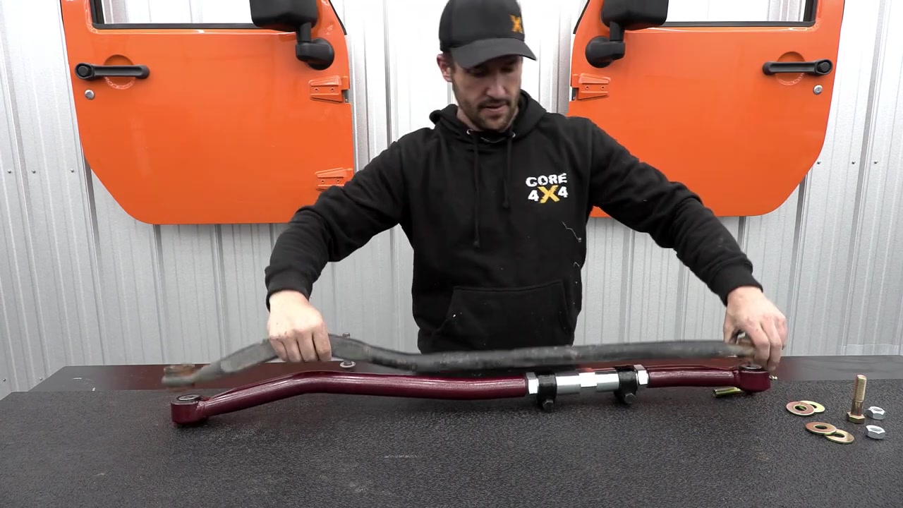 Close-up of the Core 4x4 track bar showing the turnbuckle adjuster, clamps, and jam nut detail