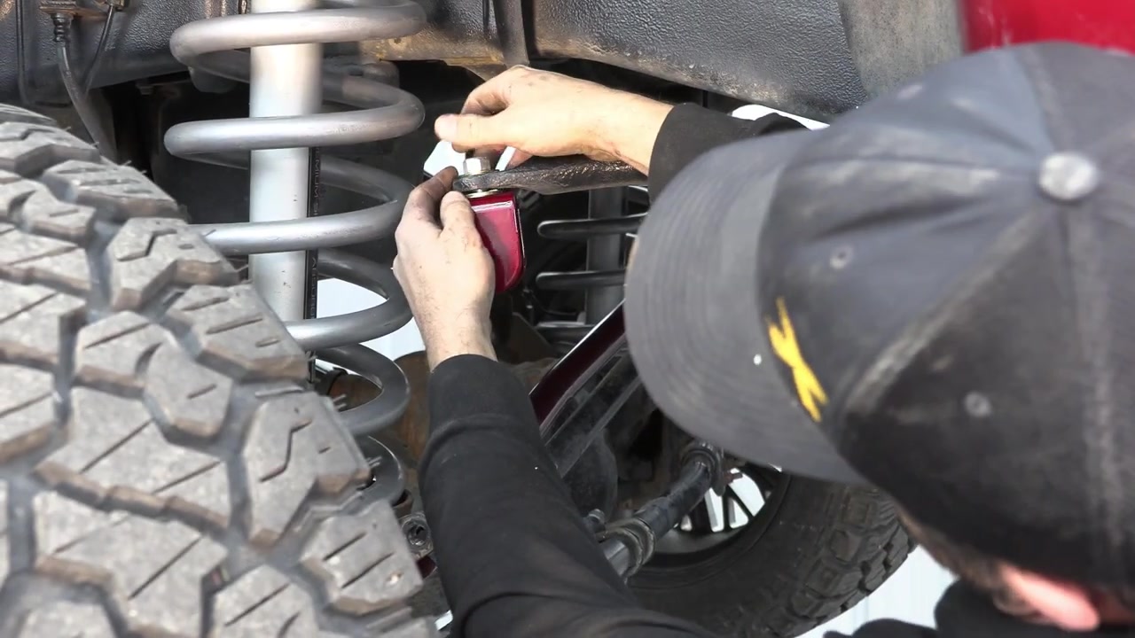 Spence installing the new Core 4x4 Tow Series sway bar end link on the Ram 3500 front suspension