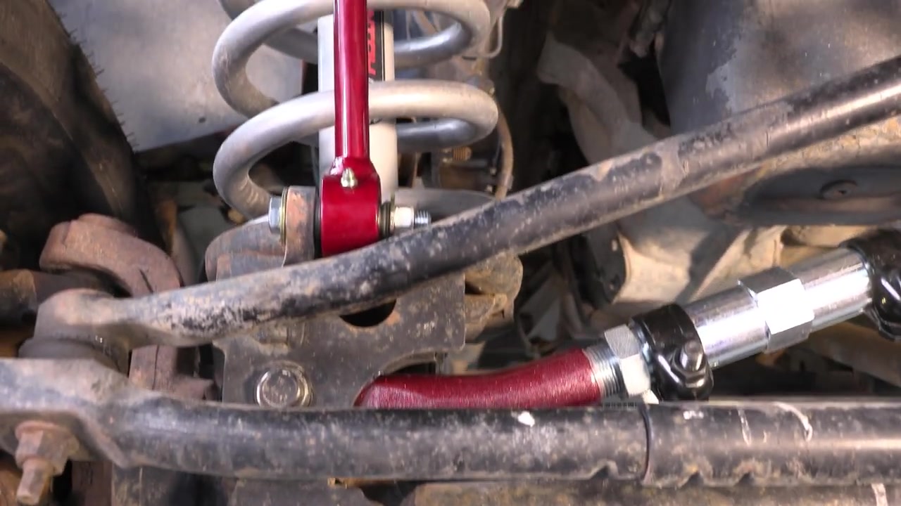 Completed installation showing Core 4x4 track bar and sway bar end link installed on the Ram 3500 front axle