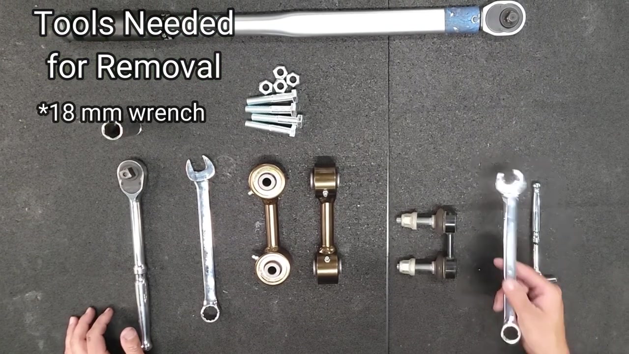 Tools needed for removal laid out on the workbench: 18mm wrench, 9mm socket, factory end links alongside Core 4x4 Crawl Series replacement end links with Johnny Joints