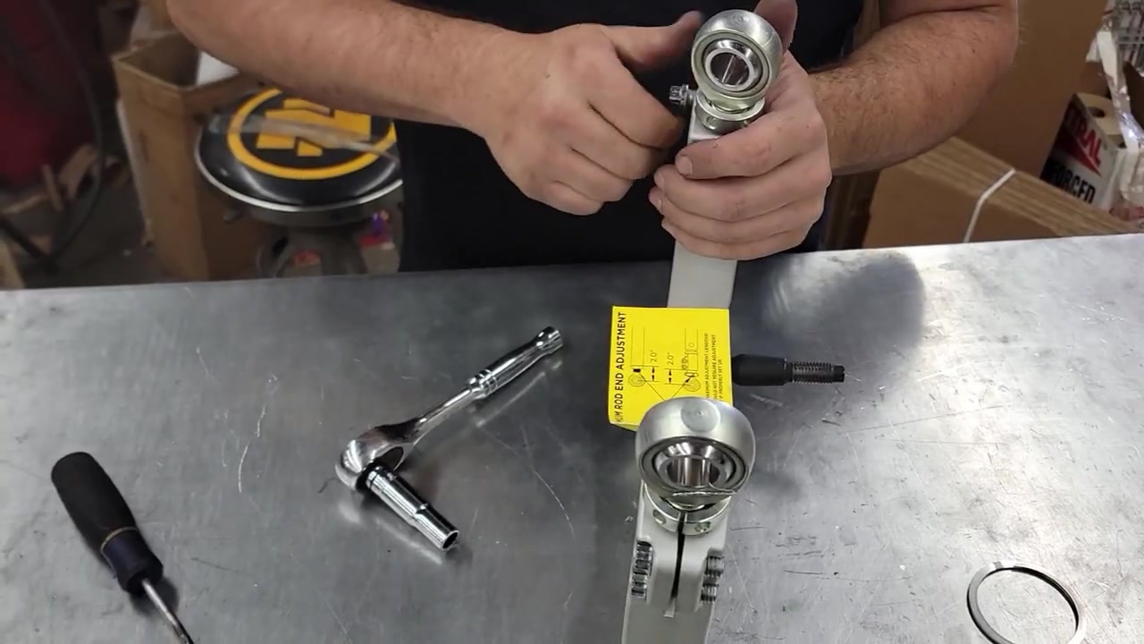 Disassembling Icon billet aluminum upper control arm on the workbench before powder coating