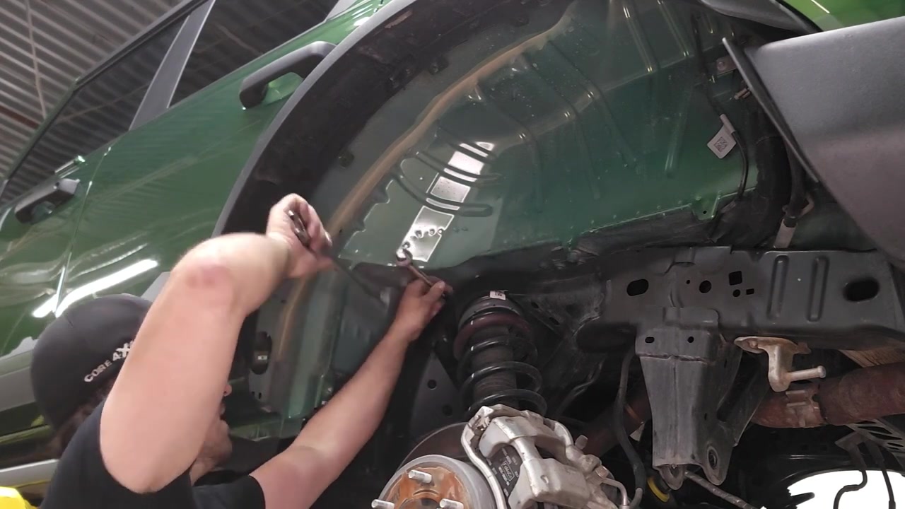 Removing inner fender liner to access coilover top mount bolts on the 2022 Ford Bronco