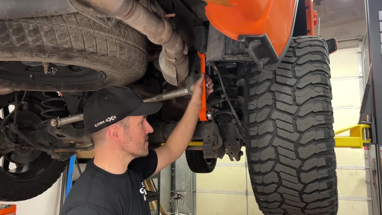 Spence checking the installed Core 4x4 end link at the sway bar connection point on the Ram 1500 rear axle