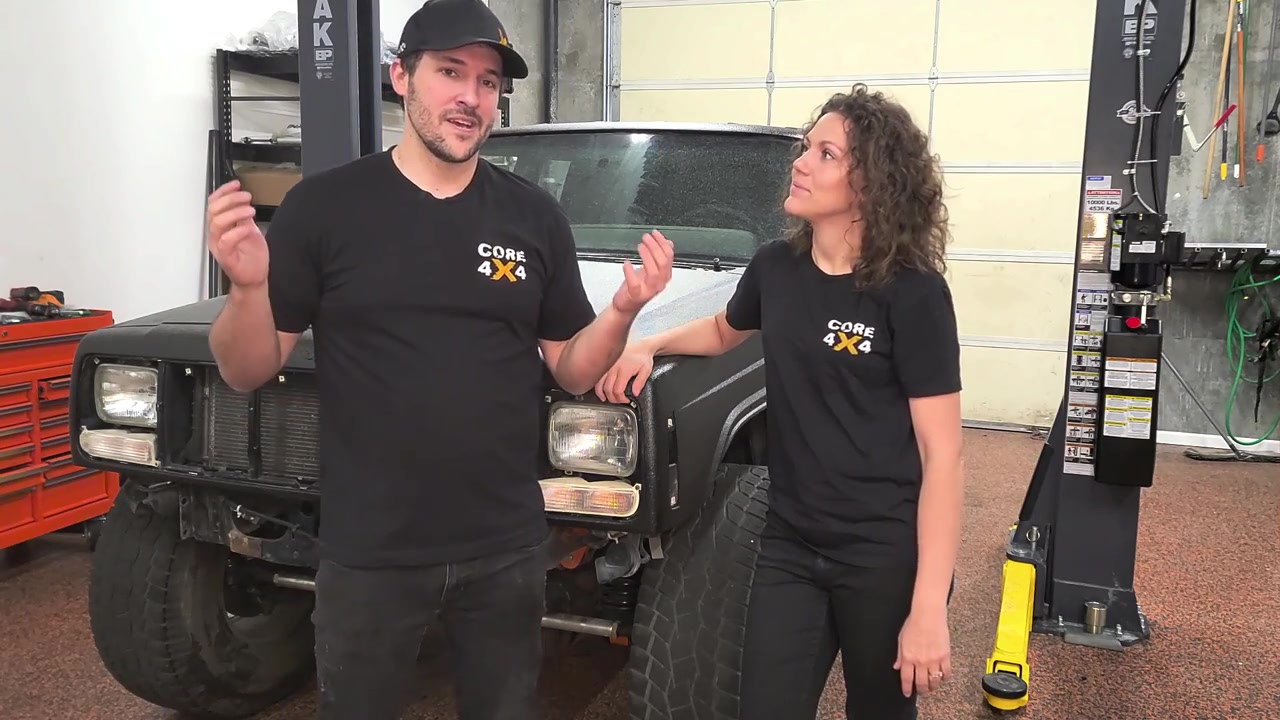Spence explaining the Dirtbound Off-Road XJ bumper build plan with the bumperless Cherokee in the background