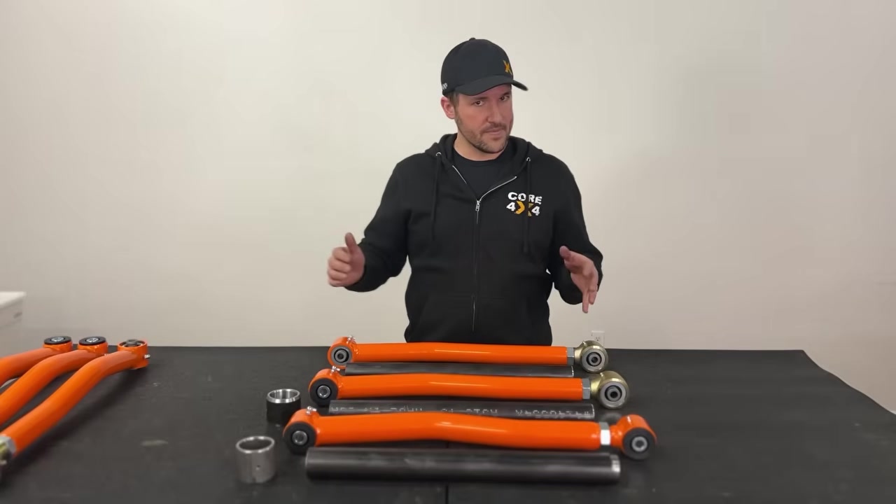 Spence explaining the differences between all three Core 4x4 control arm series on the table