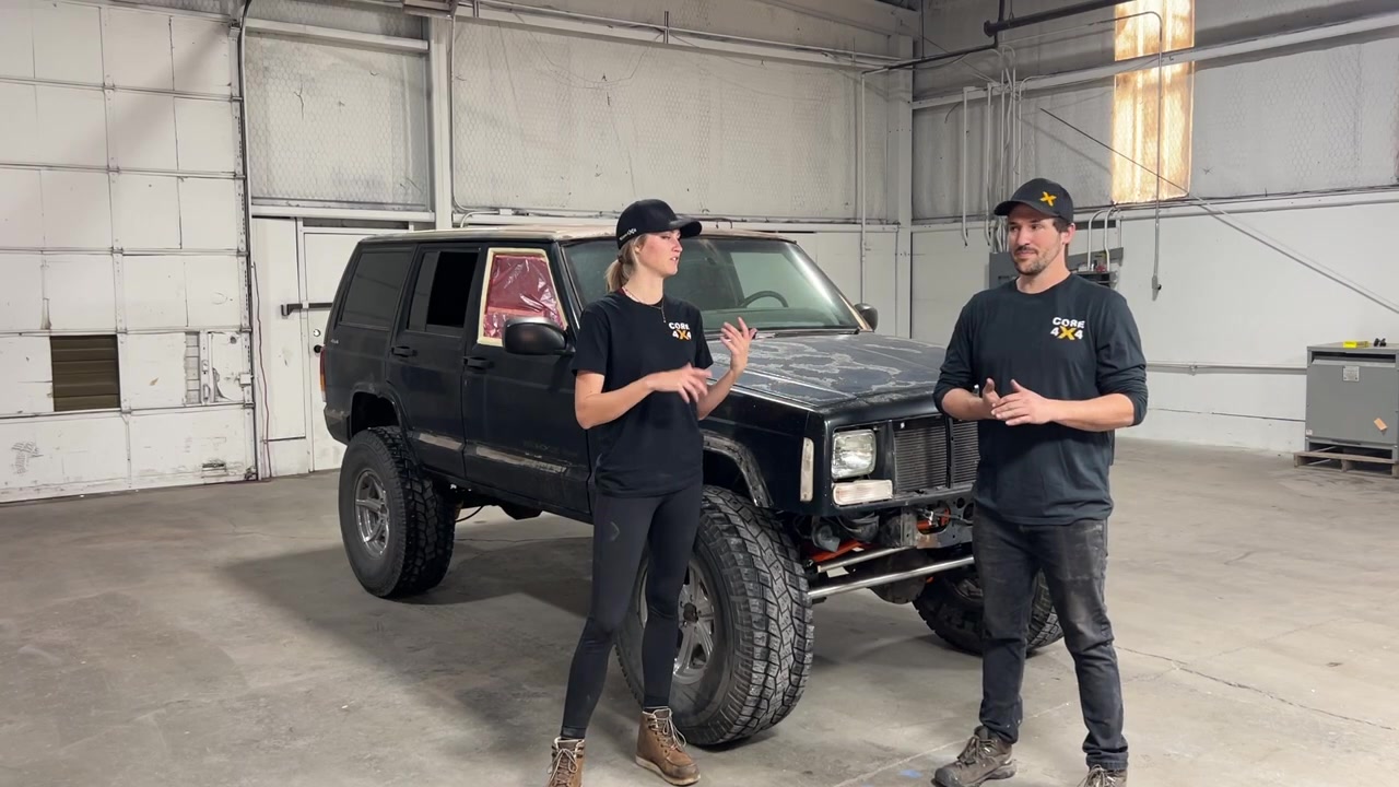 Spence and Gabby in the new empty warehouse with the stripped XJ Cherokee ready for prep work