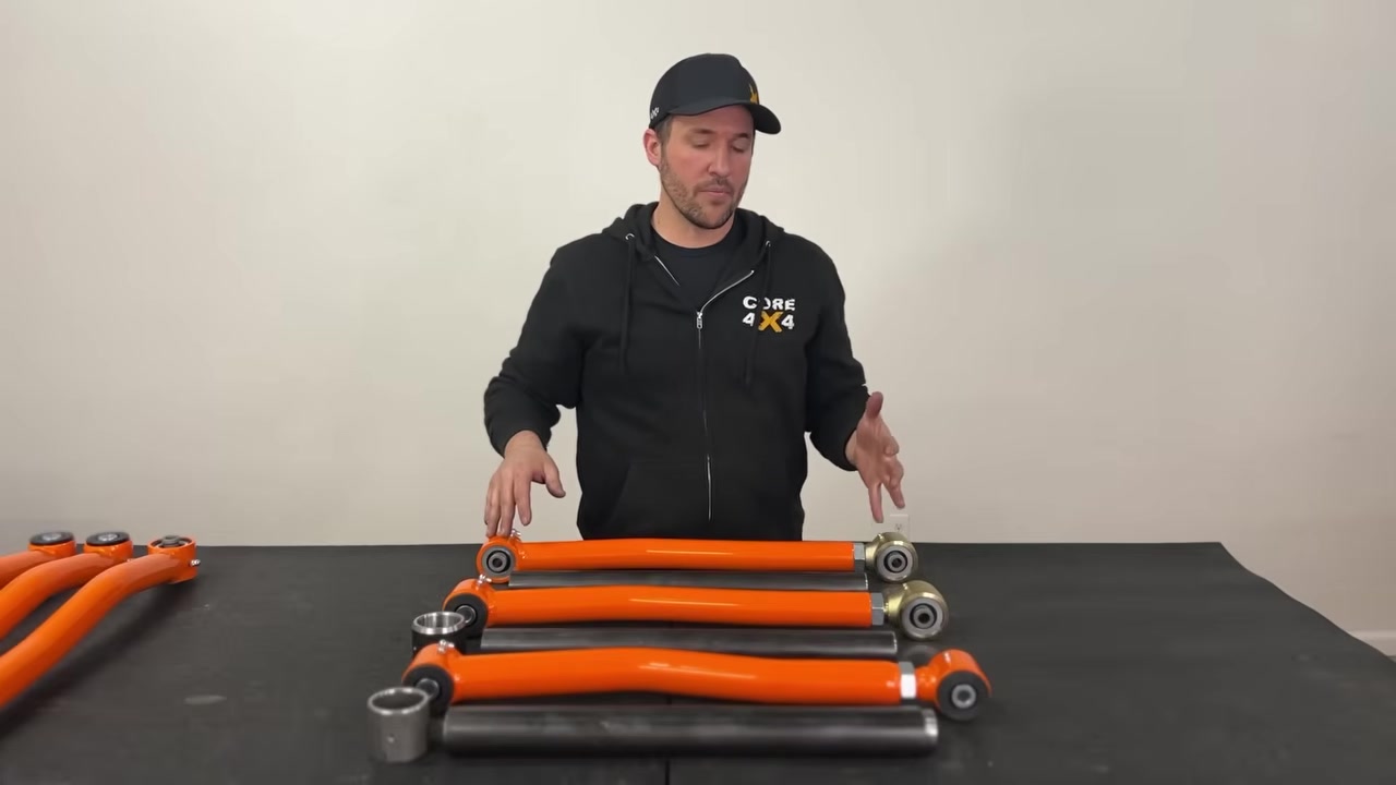 Spence pointing at the different end types across all three Core 4x4 control arm series