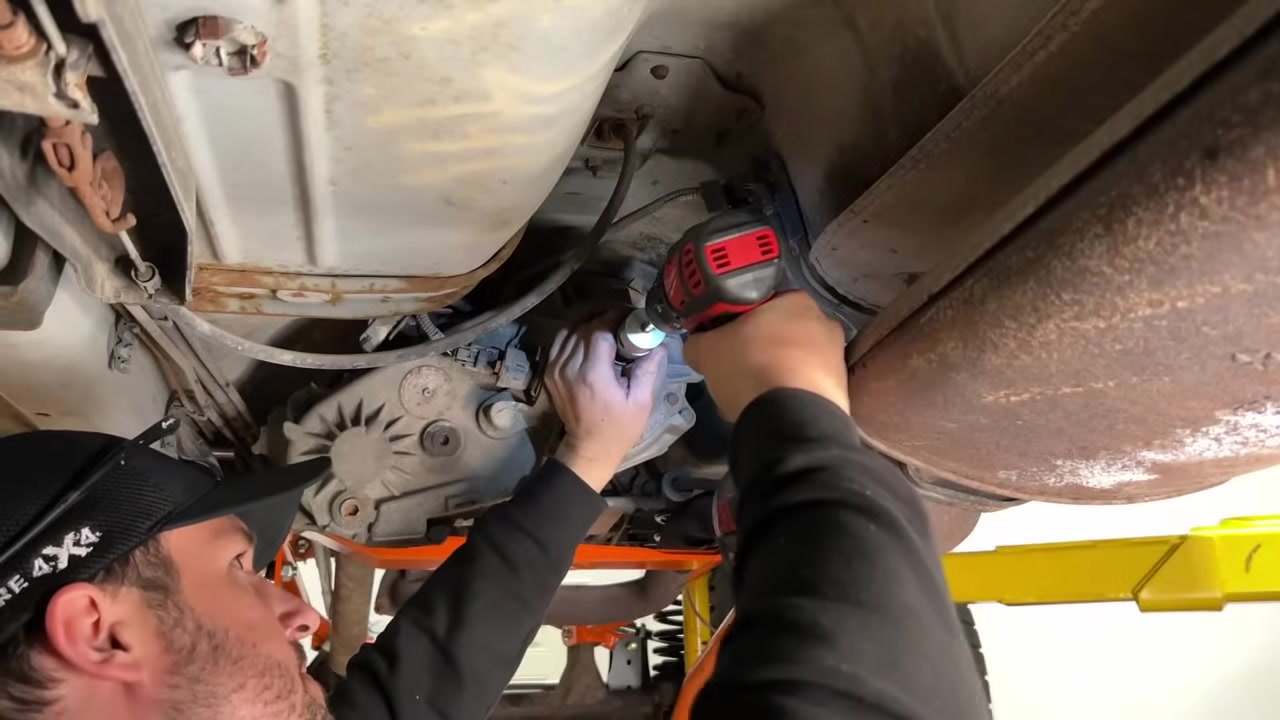 Tapping threads into the drilled hole on the transfer case output shaft for the yoke retaining bolt