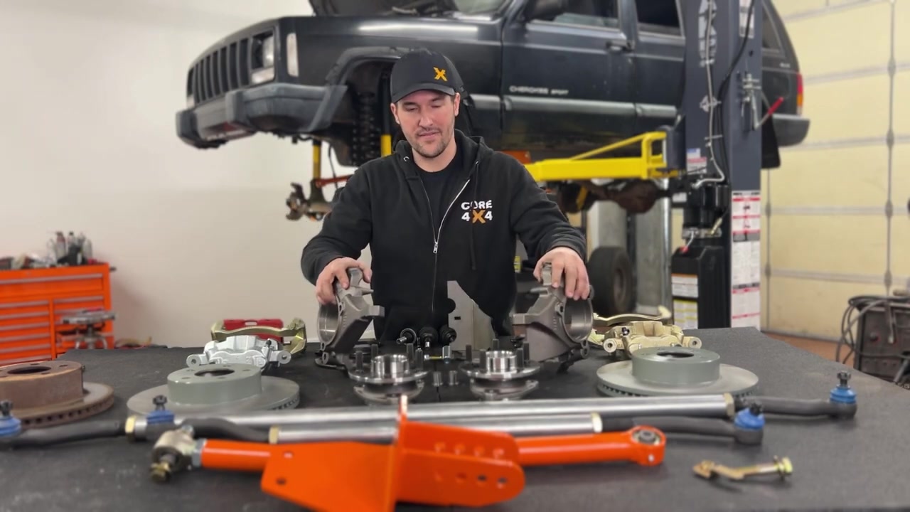 Core 4x4 heavy duty steering kit components laid out including tie rod, drag link, and hardware
