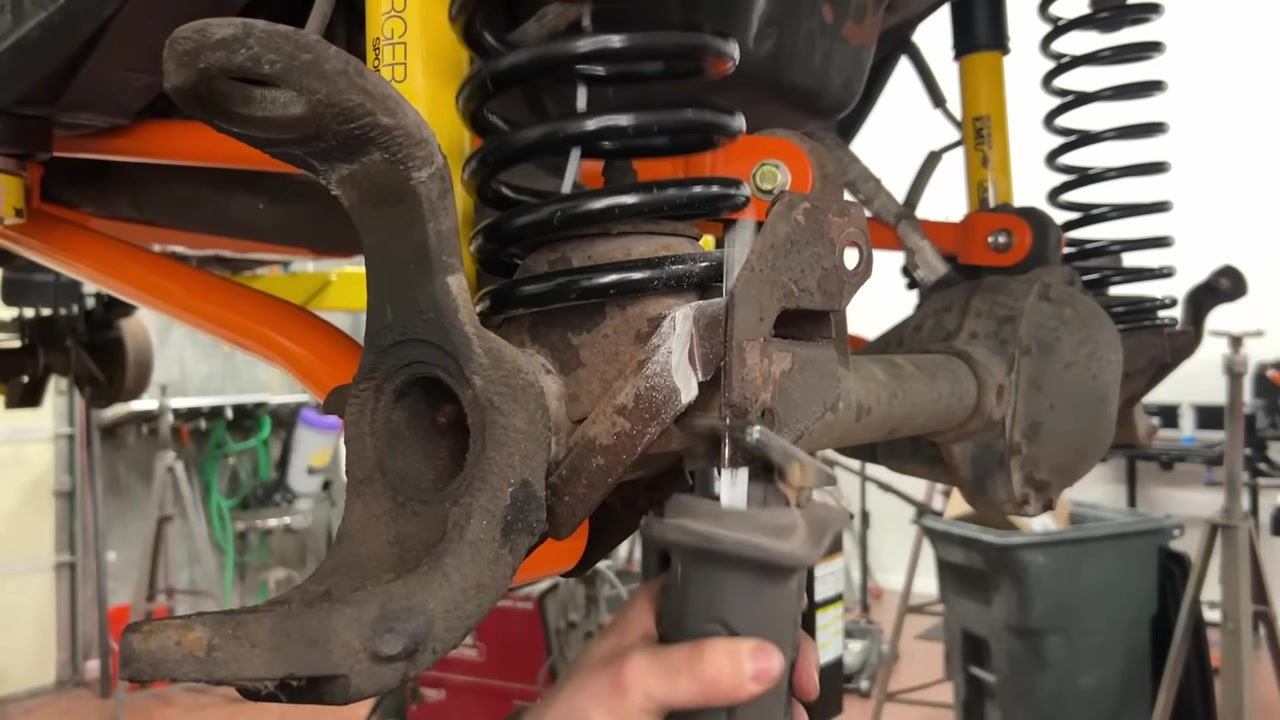 Using a ball joint press tool to remove the factory ball joints from the XJ Cherokee Dana 30 axle