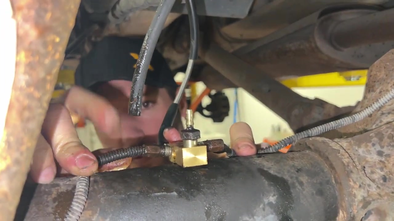 Removing leaf spring shackle bolt from XJ Cherokee frame with penetrating fluid