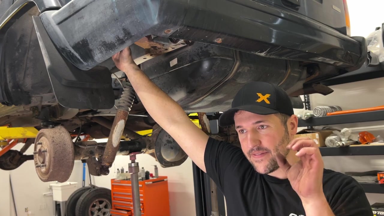 Broken upper shock bolt on XJ Cherokee subframe — common XJ problem