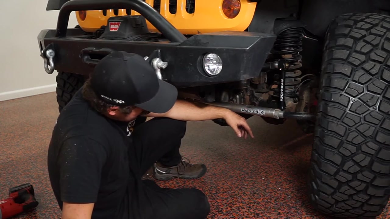 Close-up of the installed Core 4x4 crawler series front sway bar end link on the JK Wrangler showing the sway bar connection and spacer placement