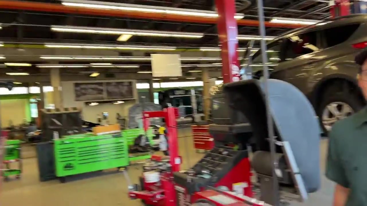 JL Wrangler on the Hunter alignment rack inside the Core 4x4 shop with alignment equipment visible
