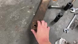 Close-up of the old worn-out control arm bushing next to new Core 4x4 Tier 4 control arm components