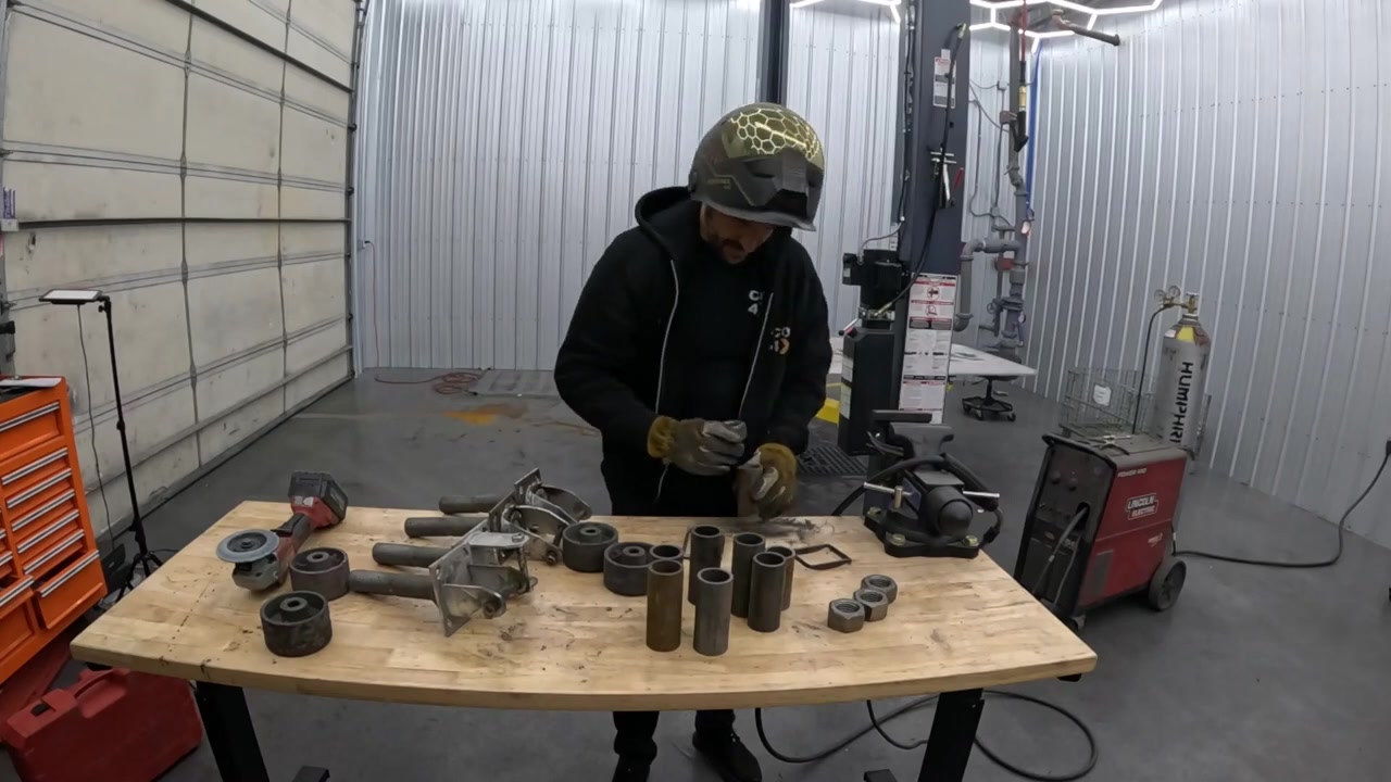 Welding caster mount hardware together for the table base powder coat oven run