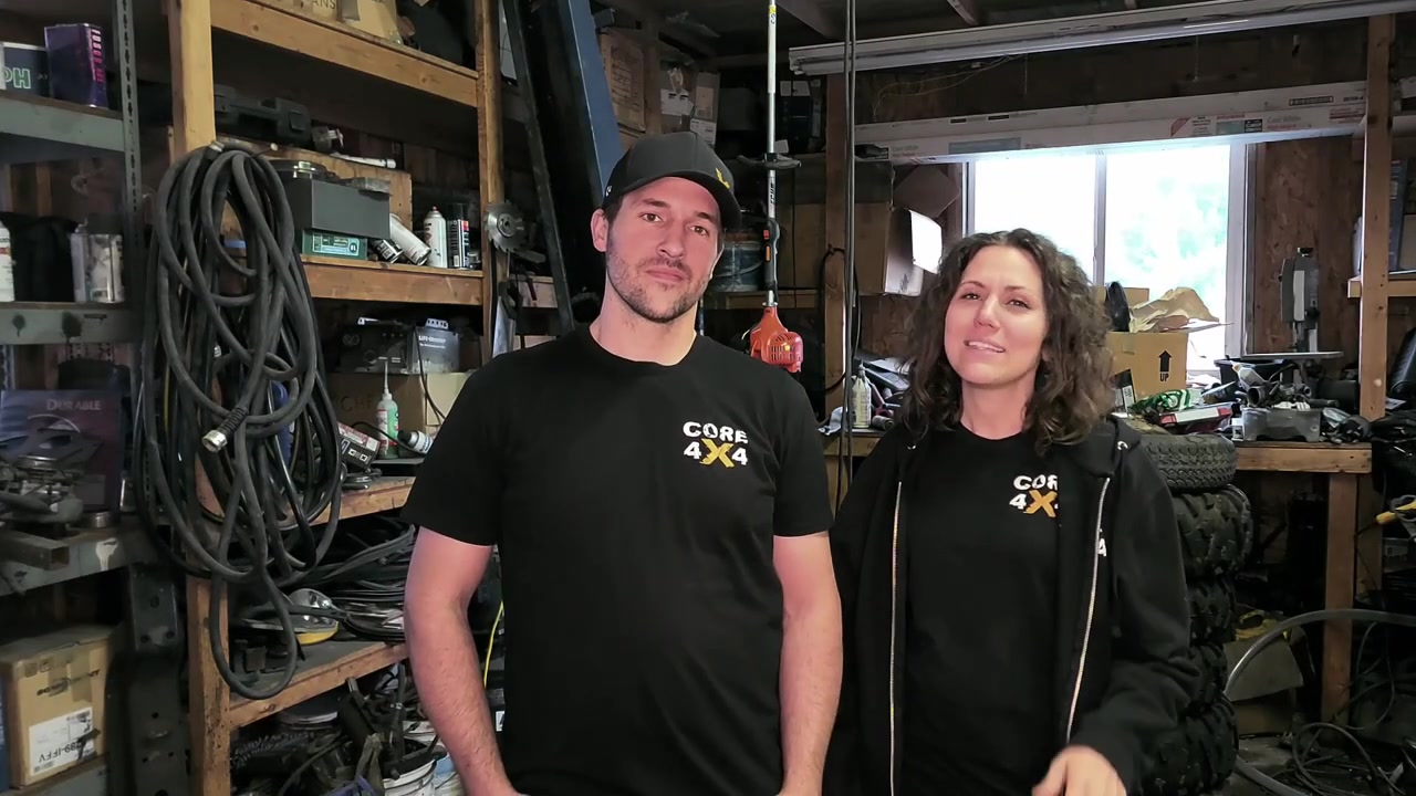 Spence and Marissa from Core 4x4 standing in the original backyard shop where the company started