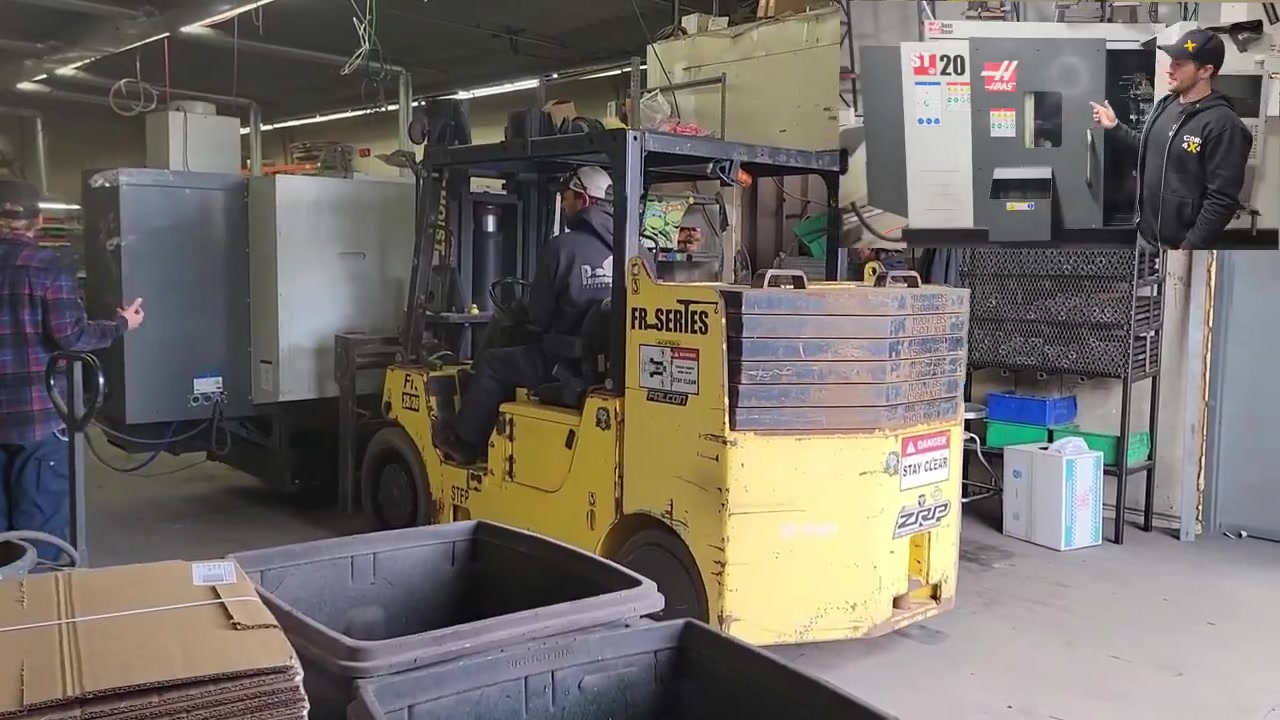 CNC lathe being prepared for rigging during the Core 4x4 shop move